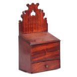 AN EARLY 19TH CENTURY MAHOGANY CANDLE BOX WITH SHAPED PIERCED BACK hinged lid and frieze drawer 43cm