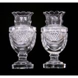 A PAIR OF 19TH CENTURY REGENCY STYLE HEAVY CUT GLASS VASES with octagonal pedestal bases and swag