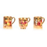 ROBERTS. THREE PIECES OF BLACK MARK ROYAL WORCESTER comprising A pair of MUGS and a CUP, each richly