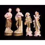 A PAIR OF LATE 19TH CENTURY ROYAL DUX BOHEMIA STANDING FIGURES depicting a Lady and Gentleman