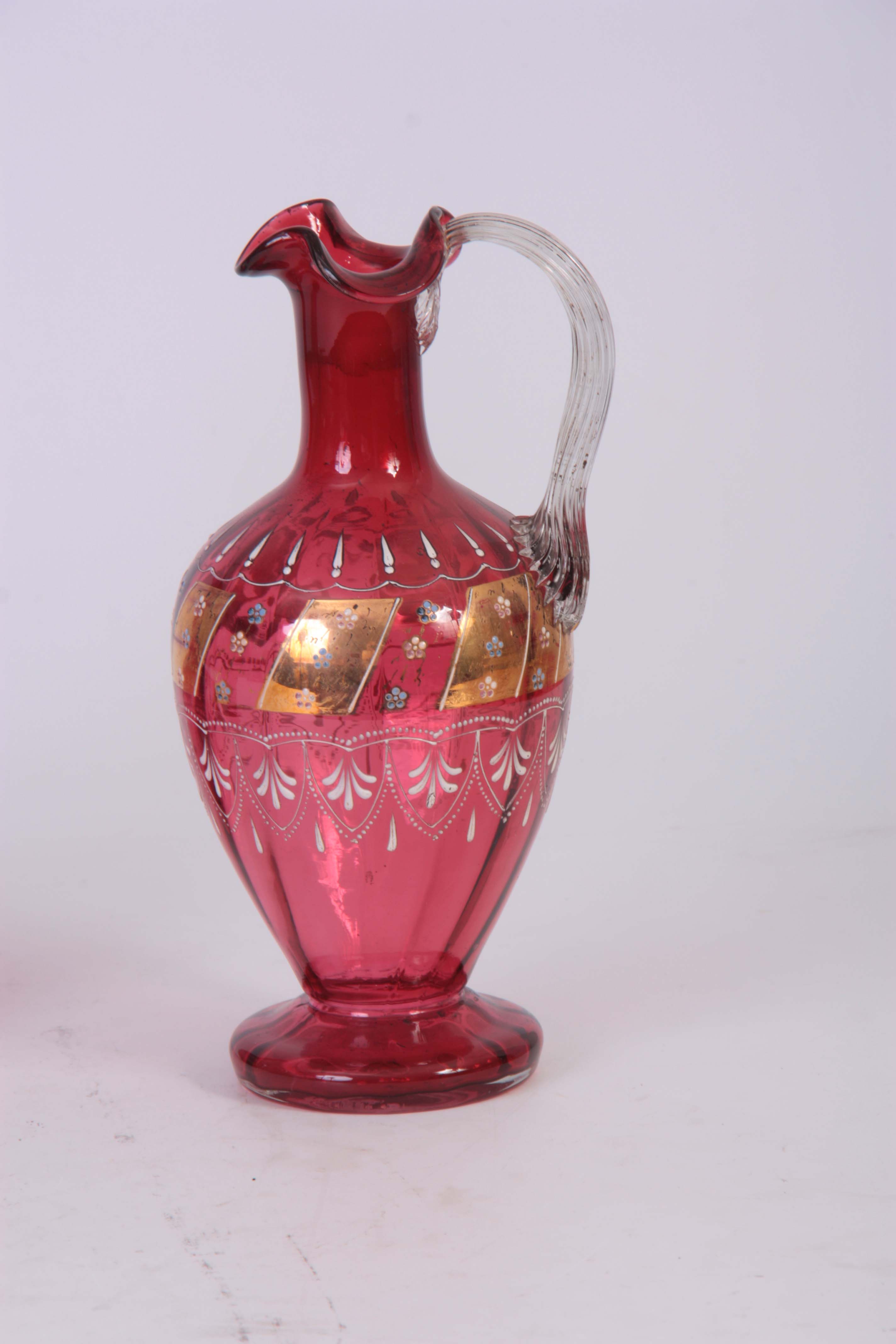 A PAIR OF VICTORIAN CRANBERRY DECANTERS with gilt panelled enamelled flower spray decoration to - Image 3 of 4