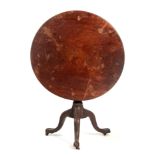 AN EARLY GEORGE III MAHOGANY TILT-TOP SUPPER TABLE the one-piece top on a revolving birdcage and