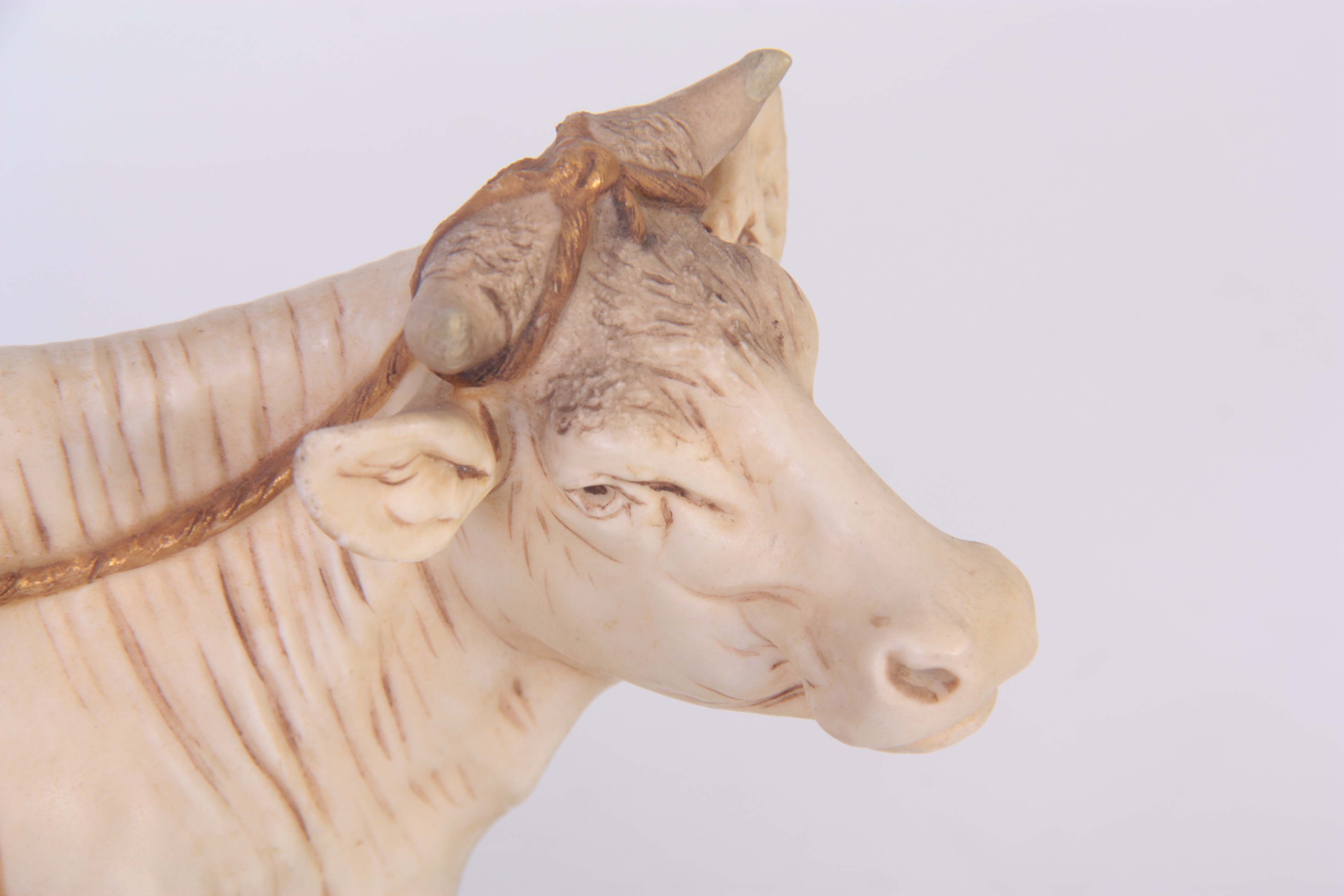 A ROYAL DUX BOHEMIA ANIMAL FIGURE modelled as a dairy cow and standing milk maid coloured in soft - Image 4 of 7