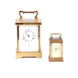 TWO 20TH CENTURY TIMEPIECE CARRIAGE CLOCKS having brass cases with white Roman dials fronting