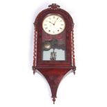 A 19TH CENTURY AMERICAN FIGURED MAHOGANY WALL CLOCK with carved pediment and barley twist columns