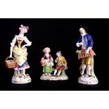 A DRESDEN SEATED FLOWER SELLER DOUBLE FIGURE GROUP 11cm high together with A PAIR OF CONTINENTAL