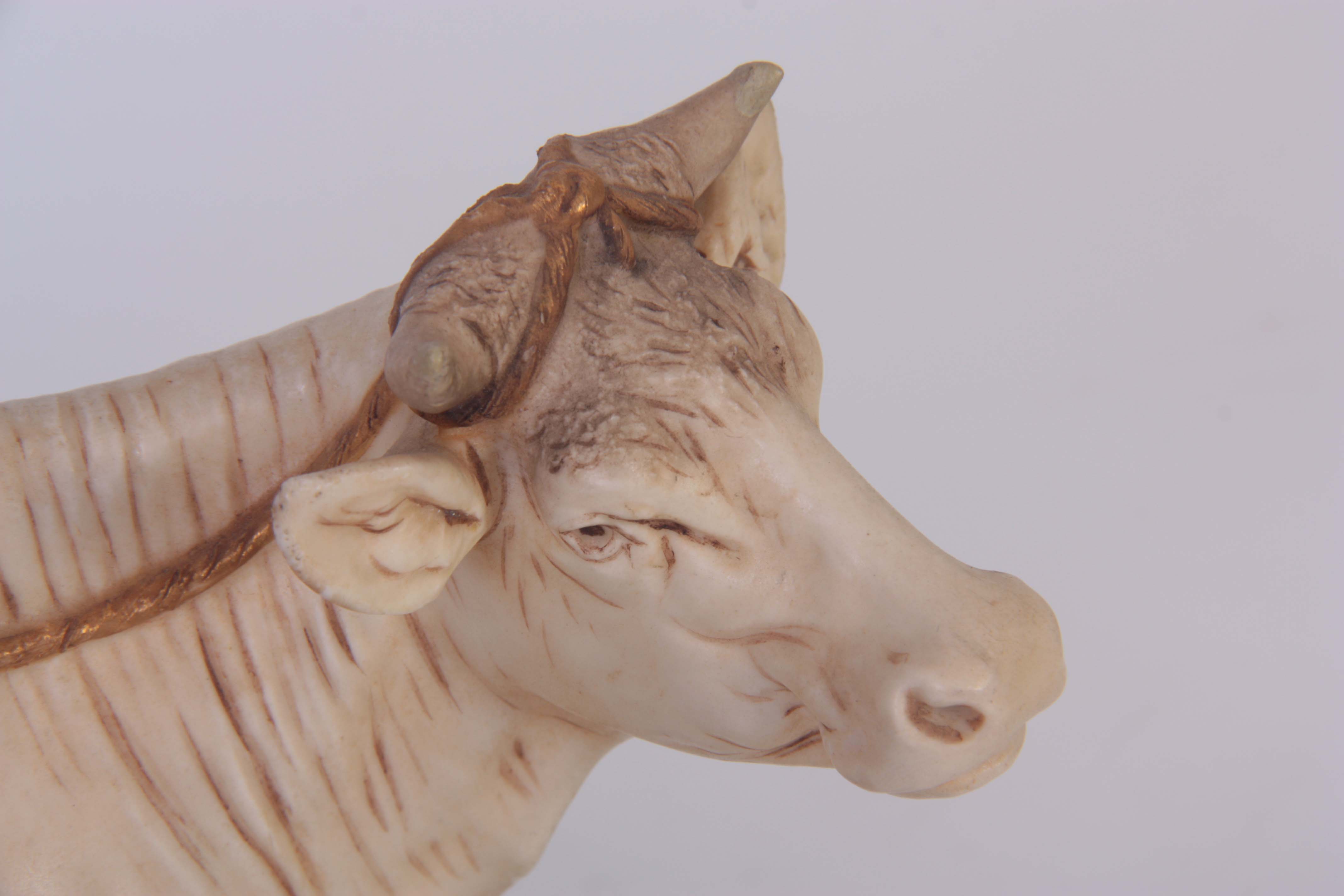 A ROYAL DUX BOHEMIA ANIMAL FIGURE modelled as a dairy cow and standing milk maid coloured in soft - Image 3 of 7