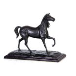 A 20TH CENTURY BRONZED SPELTER SCULPTURE OF A HORSE mounted on a naturalistic rectangular base