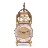 AN EARLY 20TH CENTURY LANTERN STYLE MANTEL CLOCK the brass case signed Thomas Mudge to the centre