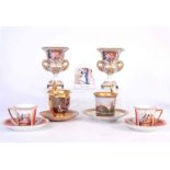 A PAIR OF MEISSEN STYLE GILT TWO HANDLED CAMPANA SHAPED VASES with floral panel decoration 16cms