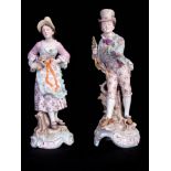 A LARGE PAIR OF CONTINENTAL CLASSICAL STANDING BOCAGE FIGURES smartly dressed in colourful costume