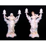 A LARGE PAIR OF LATE 19TH CENTURY GERMAN KPM BISQUE PORCELAIN TWO BRANCH CANDELABRA modelled as