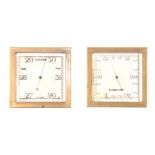 A PAIR OF BRASS CASED DESK BAROMETERS having brass square cases enclosing calibrated silvered dials,