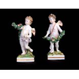 A PAIR OF EARLY 19TH CENTURY DERBY STYLE FIGURES probably Samson, Paris depicting cherubs holding