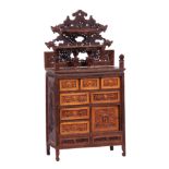 A LATE 19TH CENTURY CHINESE CARVED HARDWOOD COLLECTORS CABINET with finely carved decoration