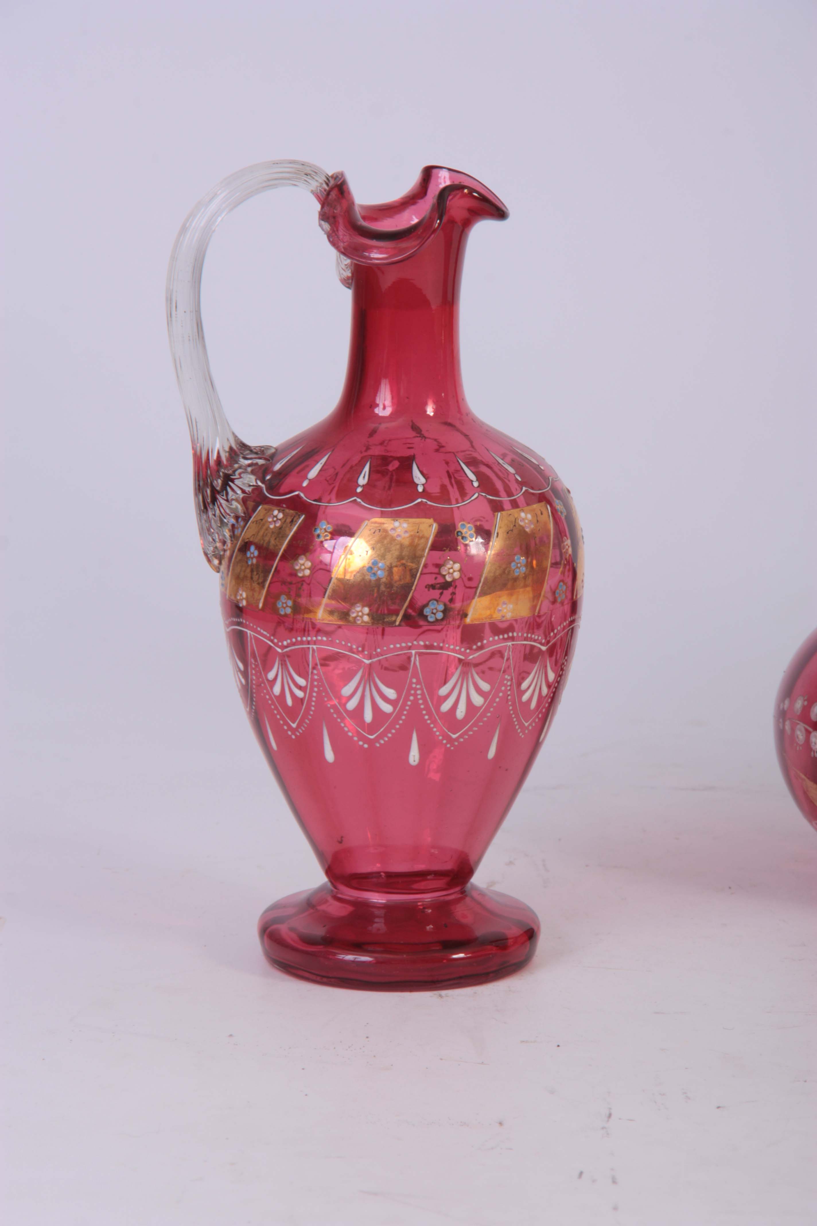 A PAIR OF VICTORIAN CRANBERRY DECANTERS with gilt panelled enamelled flower spray decoration to - Image 4 of 4