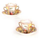 A PAIR OF LATE 19TH CENTURY AUGUSTUS REX GILT TWO-HANDLED CABINET CUPS AND SAUCERS with scroll