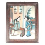 A 19TH CENTURY CHINESE REVERSE PAINTING ON GLASS interior scene with two female figures 38cm high,