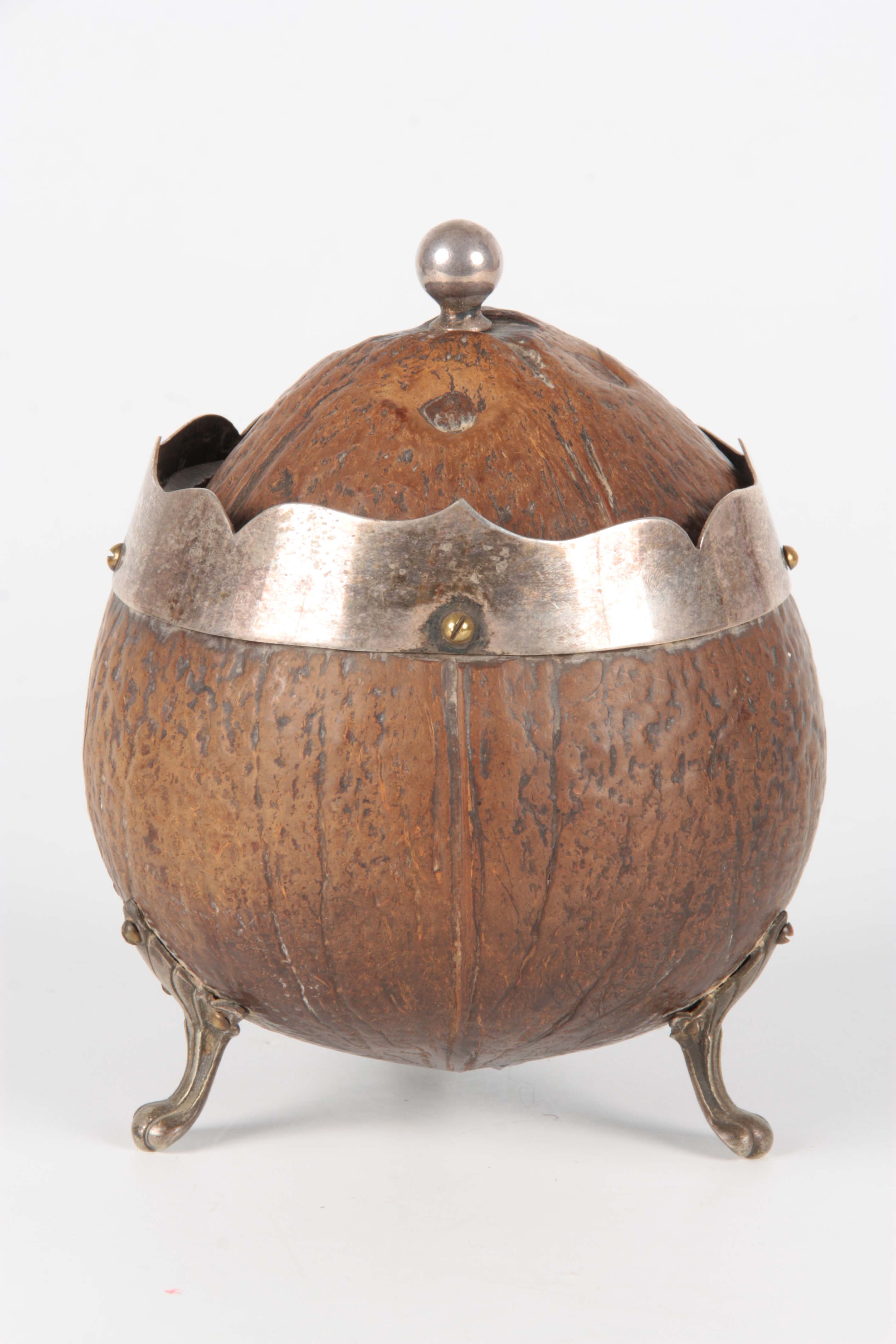 A 19TH CENTURY COCONUT CADDY with silver metal mounts and raised splay feet, the domed lid with - Image 6 of 12