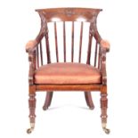 A STYLISH LATE REGENCY OAK BERGERE LIBRARY CHAIR with spindle turned leaf carved top rial and scroll