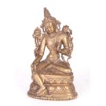 AN EARLY TIBETAN BRONZE FIGURAL SCULPTURE MODELLED AS GREEN TARA seated on a double lotus base