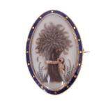 A 19TH CENTURY CENTURY YELLOW GOLD AND BLUE ENAMELLED EDGE SLENDER OVAL BROOCH set with a ribbon-