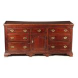 A GOOD 18TH CENTURY JOINED OAK DRESSER BASE with moulded edge plank top above two banks of graduated
