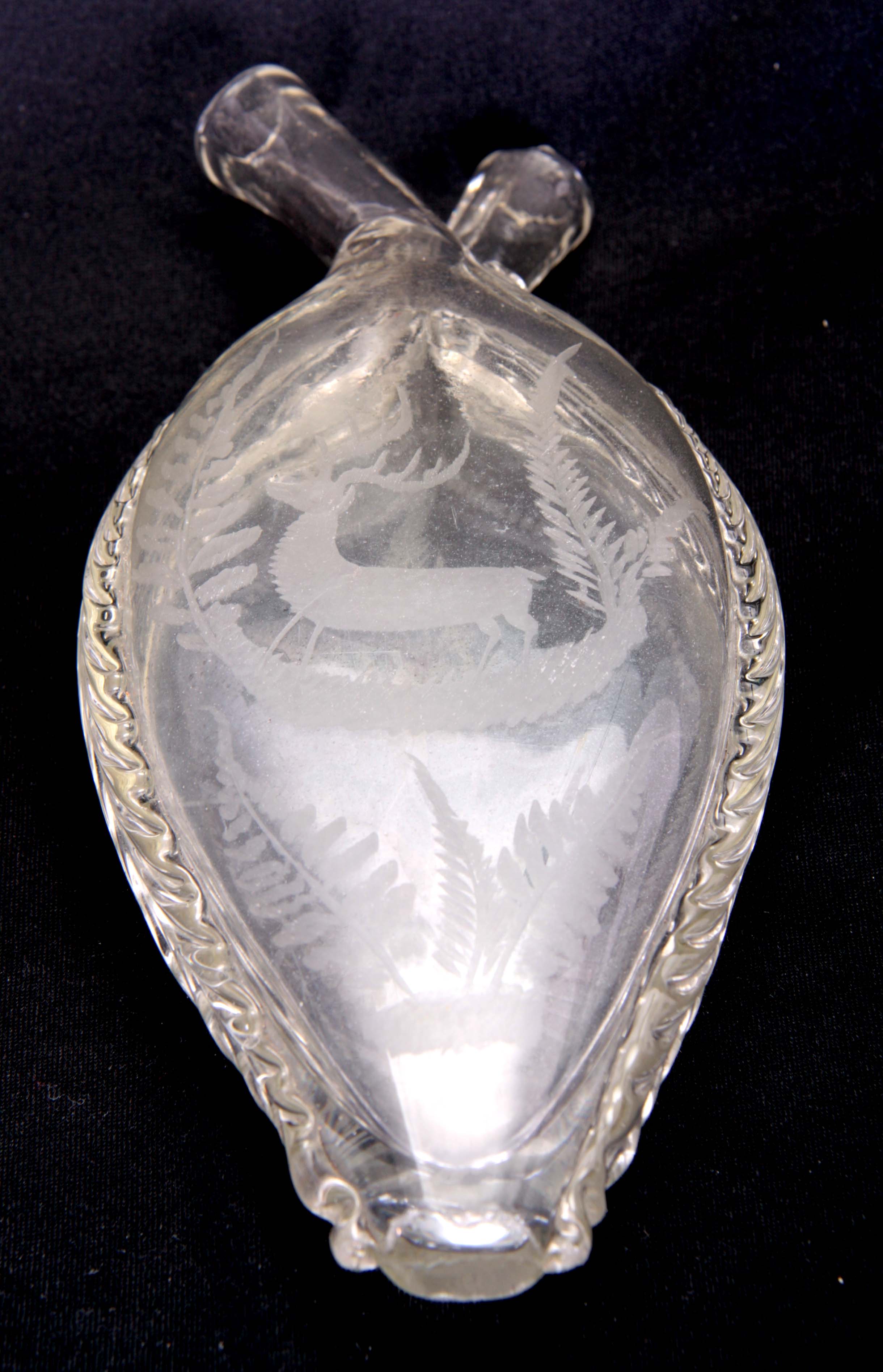 A 19TH CENTURY BOHEMIAN DOUBLE SIDED CLEAR GLASS GIMMEL FLASK of flattened tapering shouldered