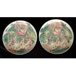 A PAIR OF CHINESE FAMILLE ROSE SHALLOW DISHES with enamelled scenes of warriors on horseback, the