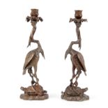 A PAIR OF 20TH CENTURY BRONZE CANDLESTICKS modeled as Cranes and Tortoises entwined by serpents,