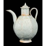 A CHINESE QINGBAI OCTAGONAL SHAPED CELADON GLAZED EARTHENWARE TEAPOT decorated with floral designs