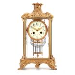 A LATE 19TH CENTURY FRENCH FOUR-GLASS MANTEL CLOCK the brass case enclosing a 4" floral painted