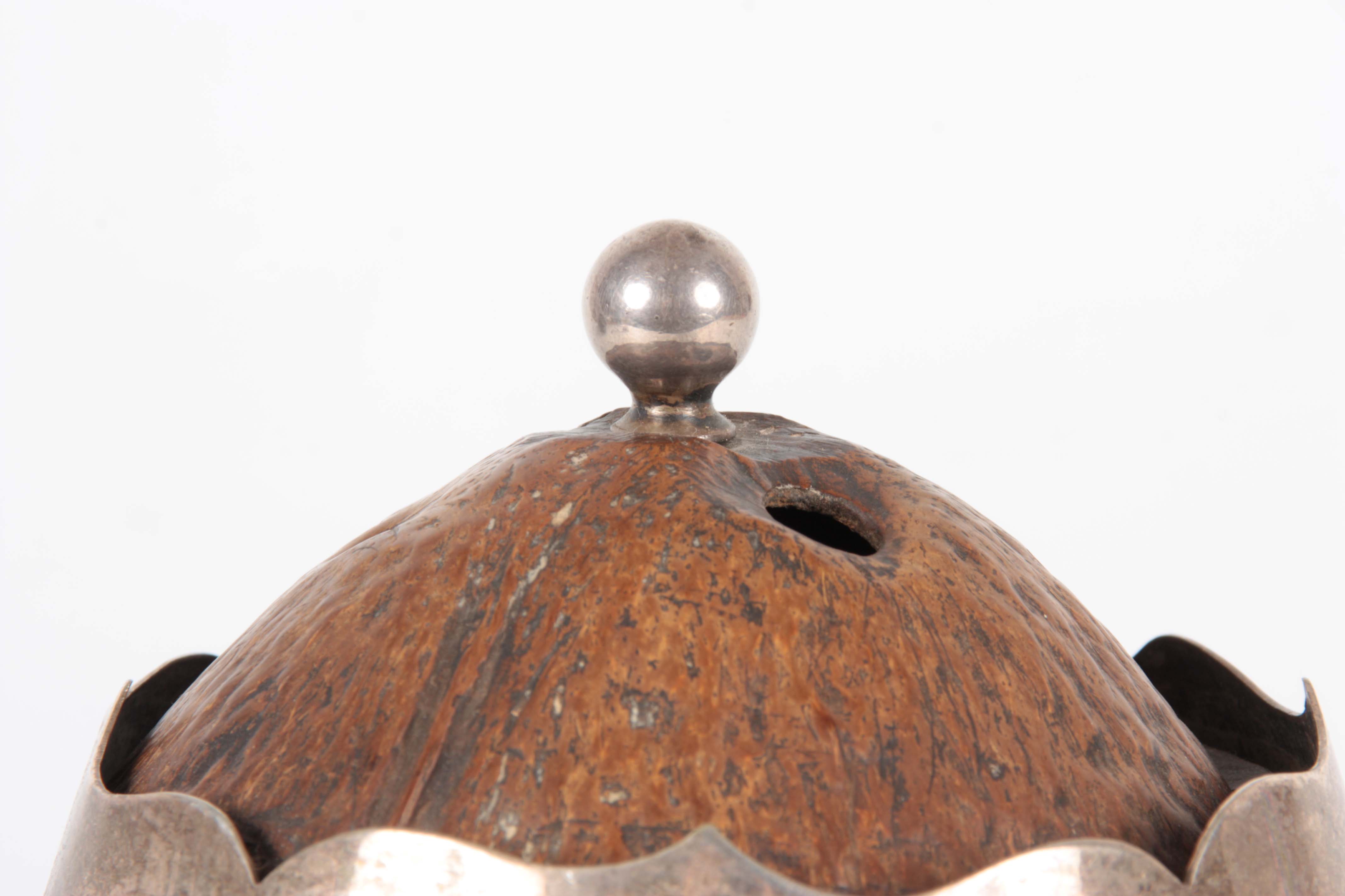 A 19TH CENTURY COCONUT CADDY with silver metal mounts and raised splay feet, the domed lid with - Image 4 of 12