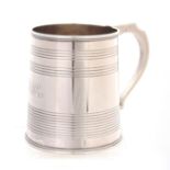 A GEORGE IV SILVER HALF PINT MUG of tapering form with ribbed banded body, engraved monogram and