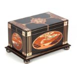 A FINE ARTS AND CRAFTS DESIGN MARQUETRY PANELLED AND GEOMETRICALLY INLAID EBONY CASKET the top