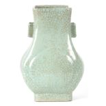 A CHINESE CRACKLE GLAZE CELADON VASE of rectangular pear-shape raised on flared foot with fitted