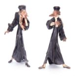 AN UNUSUAL PAIR OF LATE 19TH CENTURY BRONZED AND PAINTED CAST METAL FIGURAL CANDLESTICKS - one