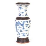 A 19TH CENTURY CHINESE CRACKLE GLAZE BALUSTER VASE decorated in blue with carvorting dragons on a