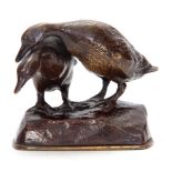 A 20TH CENTURY PATINATED BRONZE SCULPTURE depicting a pair of ducks, on a naturalistic base 8.5cm
