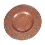 AN ART NOUVEAU PATINATED COPPER CHARGER with relief work floral design, WMF mark on reverse Circa