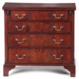 A 20TH CENTURY GEORGE III STYLE MAHOGANY BACHELORS CHEST with hinged fold over top above four
