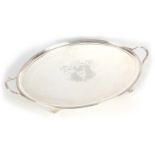 A GEORGE III SILVER TWO HANDLED OVAL TRAY having a raised reeded edge and large engraved armorial
