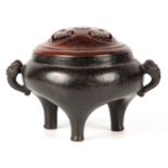 AN EARLY CHINESE BRONZE CENSER with pierced carved hardwood cover, the body of baluster form with