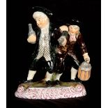 A 19TH CENTURY STAFFORDSHIRE PEARLWARE FIGURE GROUP modelled as The Parson and Clerk, the two