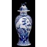 A 19TH CENTURY BLUE AND WHITE CHINESE BALUSTER VASE AND COVER WITH DOG OF FO FINIALS decorated