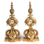 AN IMPRESSIVE PAIR OF MASSIVE 19TH CENTURY BRASS ANDIRONS OF ORNATE DESIGN with shaped scrolled