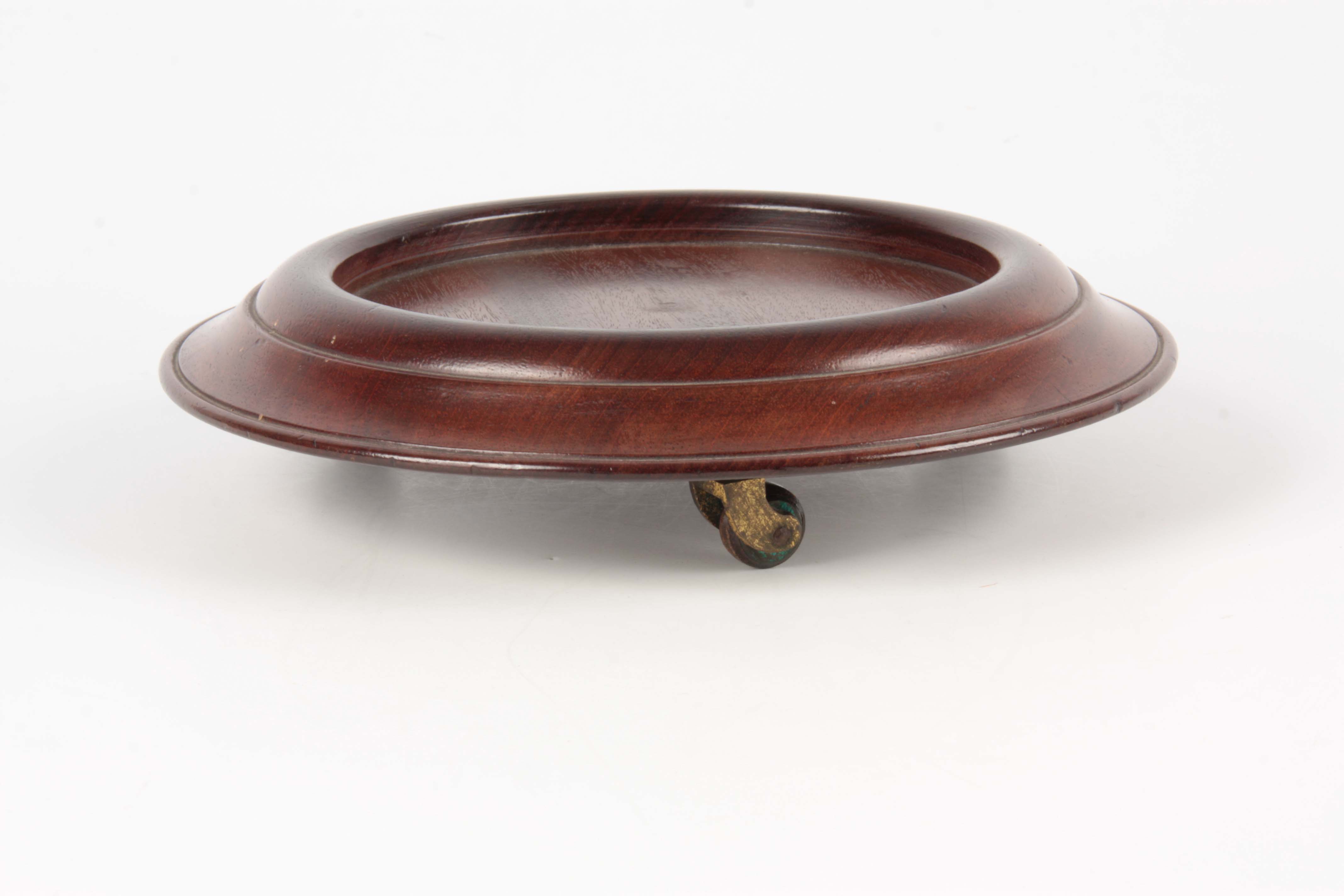 A GEORGE III MAHOGANY TABLE BOTTLE COASTER of circular form with moulded border, raised on revolving - Image 2 of 3