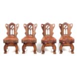 A SET OF FOUR ARTS AND CRAFTS GOTHIC STYLE OAK SIDE CHAIRS IN THE MANNER OF PUGIN with shaped