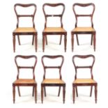 A FINE SET OF SIX LATE REGENCY ROSEWOOD DINING CHAIRS ATTRIBUTED TO GILLOWS the shaped open backs