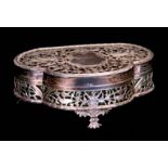 A GEORGE V TREFOIL SHAPED SILVER FILIGREEWORK DRESSING TABLE BOX WITH LINED INTERIOR the body with